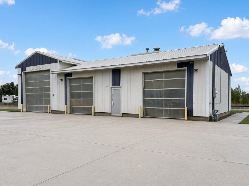 Side view of the Tracy Clean Works building showing the truck bay door and wash bay doors